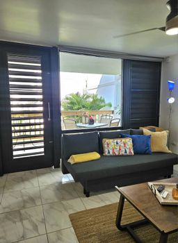 This inviting sofa offers a comfortable spot to kick back and relax. With easy access to natural light and a pleasant view, it's a versatile space for all your downtime needs.