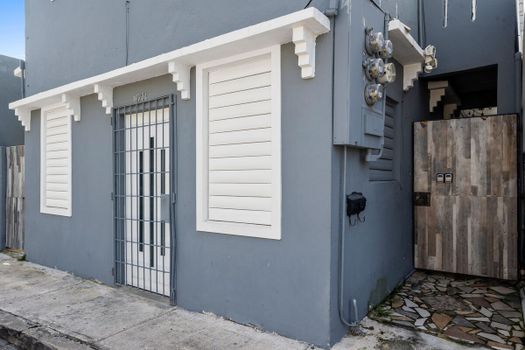 From the outside, you can see the wooden gate that leads to our studio apartment.