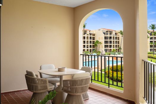 Step out onto your private balcony and enjoy refreshing breezes with glimpses of the sparkling pool.