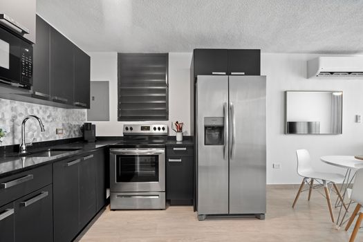Prepare meals with ease in our sleek and efficient kitchen.