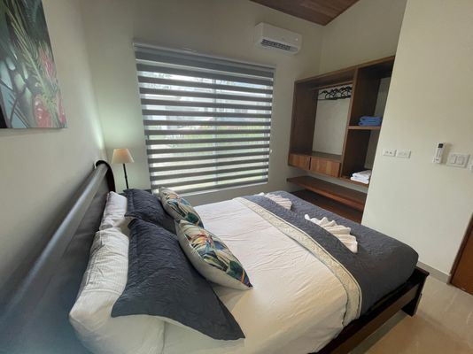 Beautiful bedroom #2 with a queen bed, AC and ceiling fan.