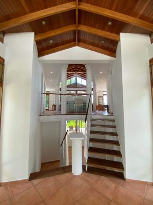 Entrance of the home - 
Upstairs there is the main floor ( Living room, Kitchen, laundry, half bathroom, Tv area and covered balcony 

Downstairs there are the 2 suits, second living area  desk and pool access