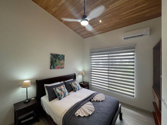 Beautiful bedroom #2 with a queen bed, AC and ceiling fan.