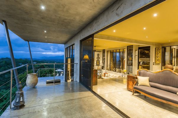 Open the floor-to-ceiling doors of the living room to enjoy the views, breezes and sounds of the jungle and Pacific Ocean