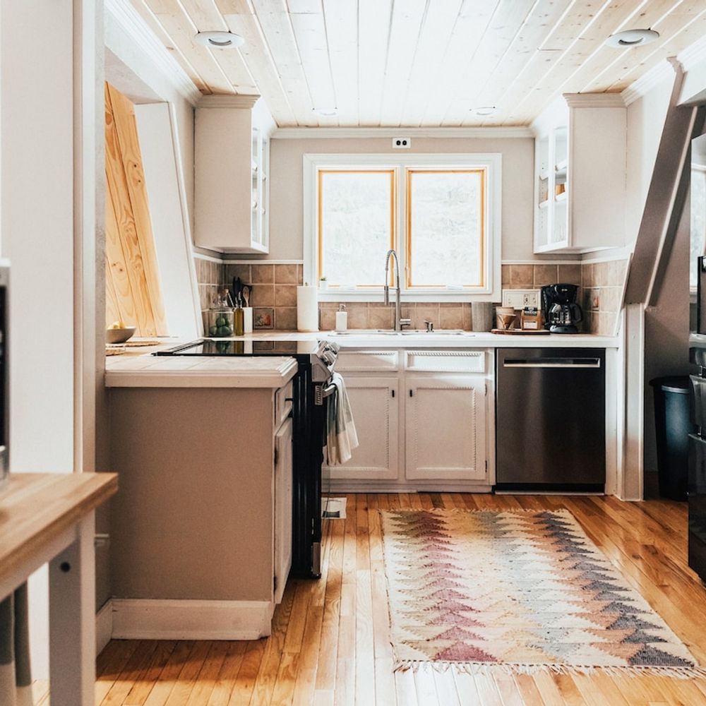 Full kitchen with new appliances and a picturesque view from the sink