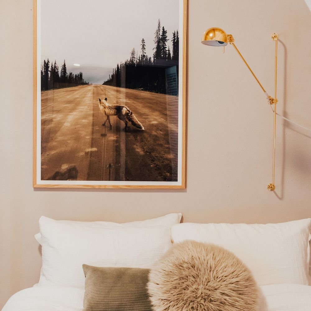 Snuggle up with a book and this reading light over the queen sized bed
