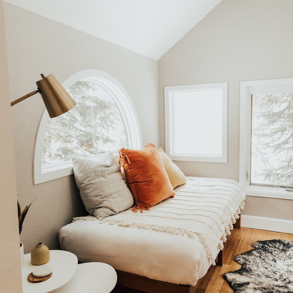Twin size daybed in a creekside sunroom off the primary bedroom