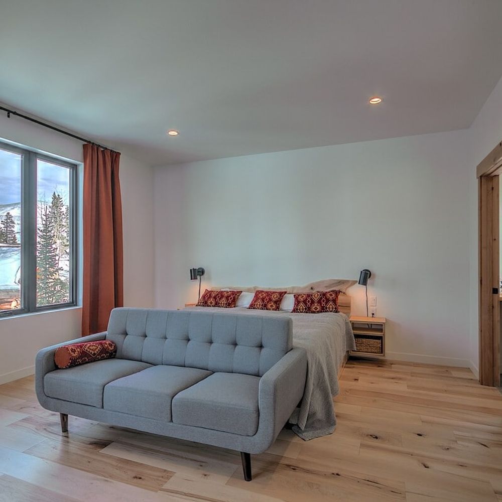 Primary bedroom with seating and king bed