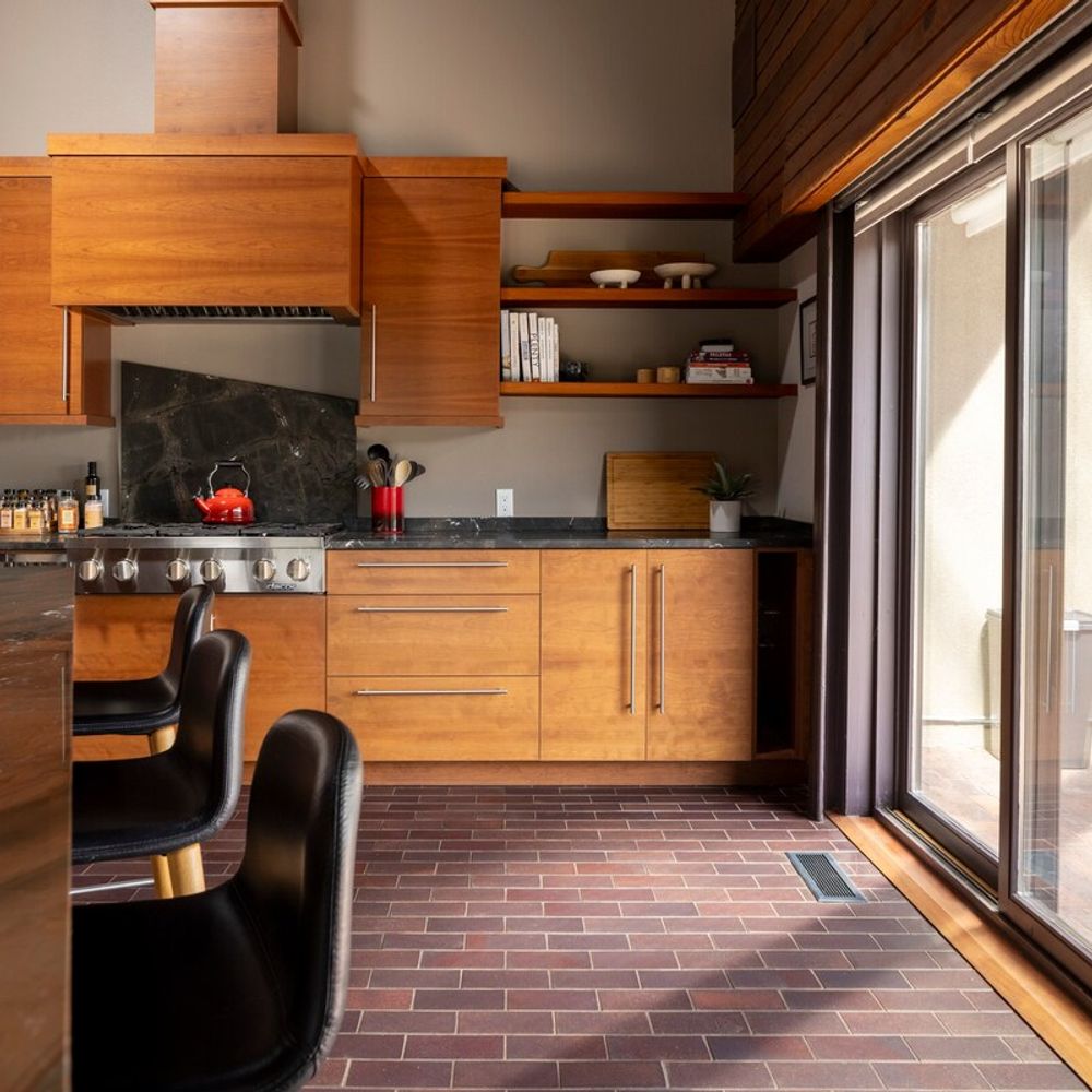 The kitchen has sliding doors leading to the covered back patio