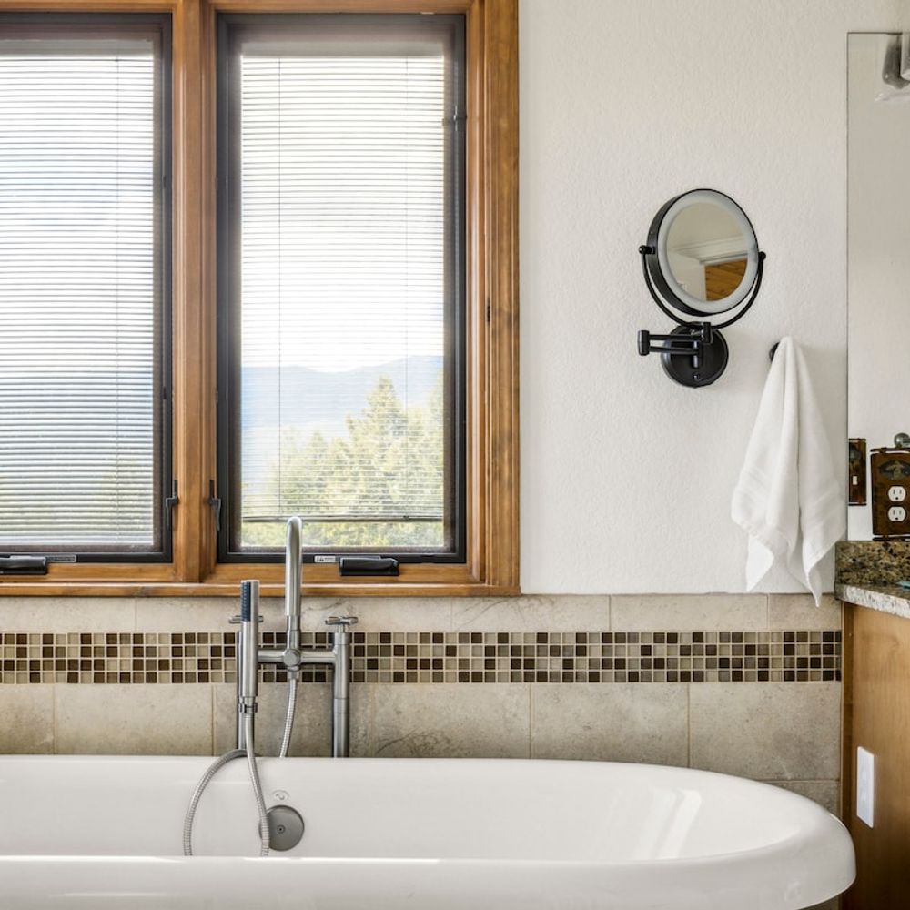 Primary bedroom's private full ensuite bathroom with soaking tub