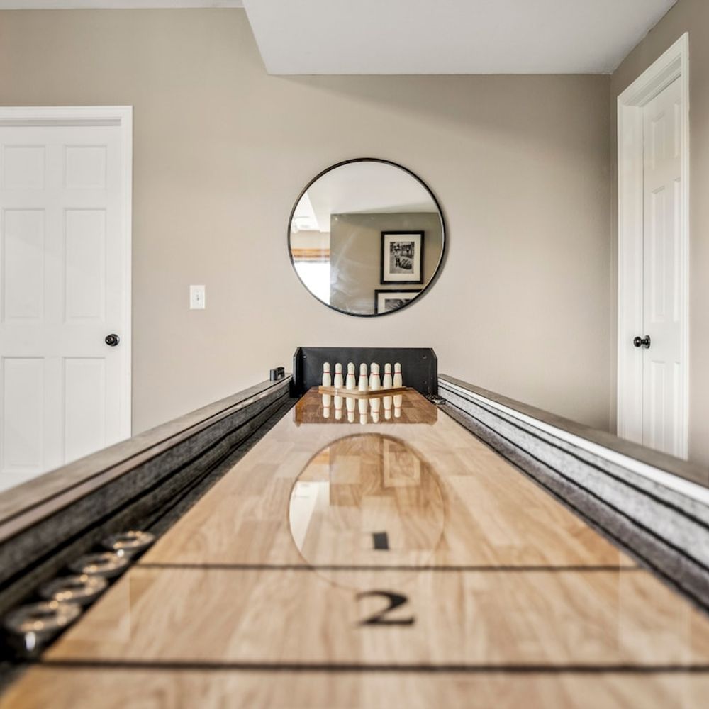 Game room with tabletop shuffleboard