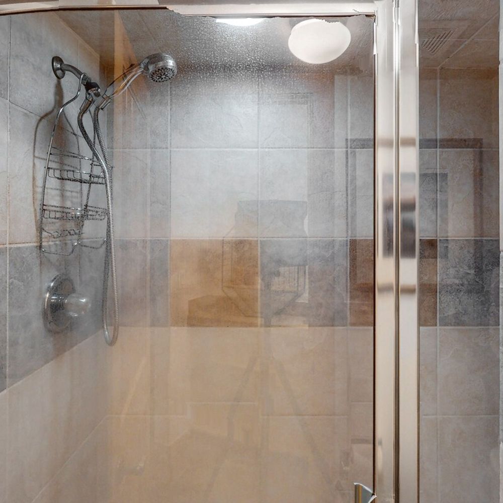 Full bathroom with walk-in glass shower