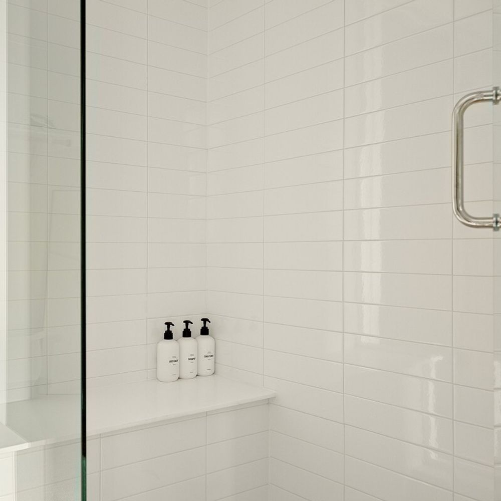 En suite bathroom has a large glass walk-in shower