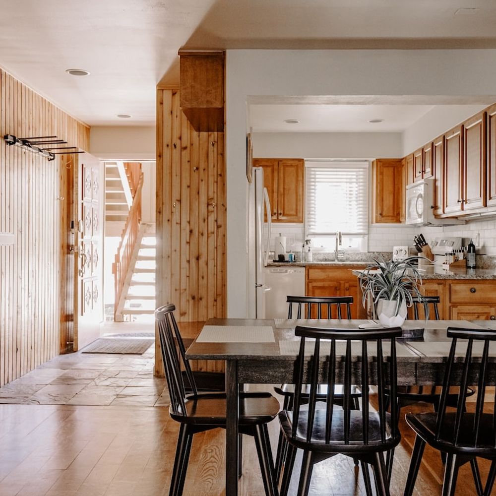 Entryway with dining area and kitchen