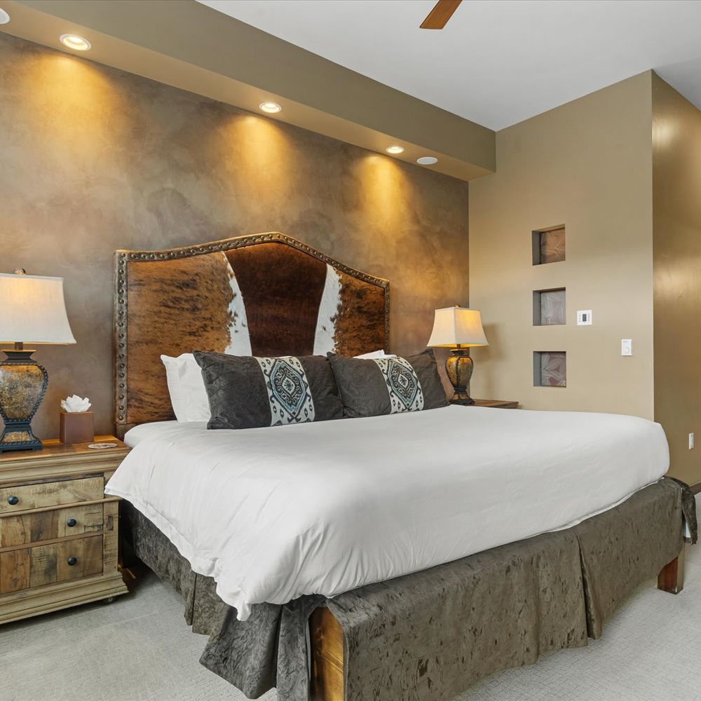 Primary bedroom with king bed and en suite bathroom