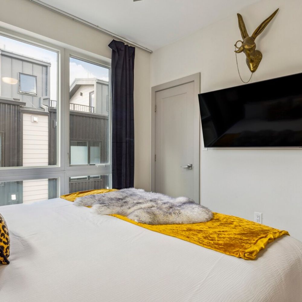 Primary bedroom with flatscreen TV