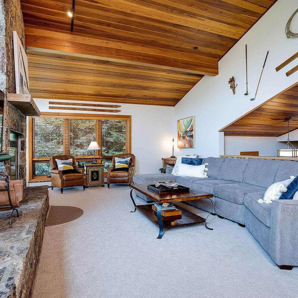 Ample seating in the living area - The wood fireplace is not available for guest use.