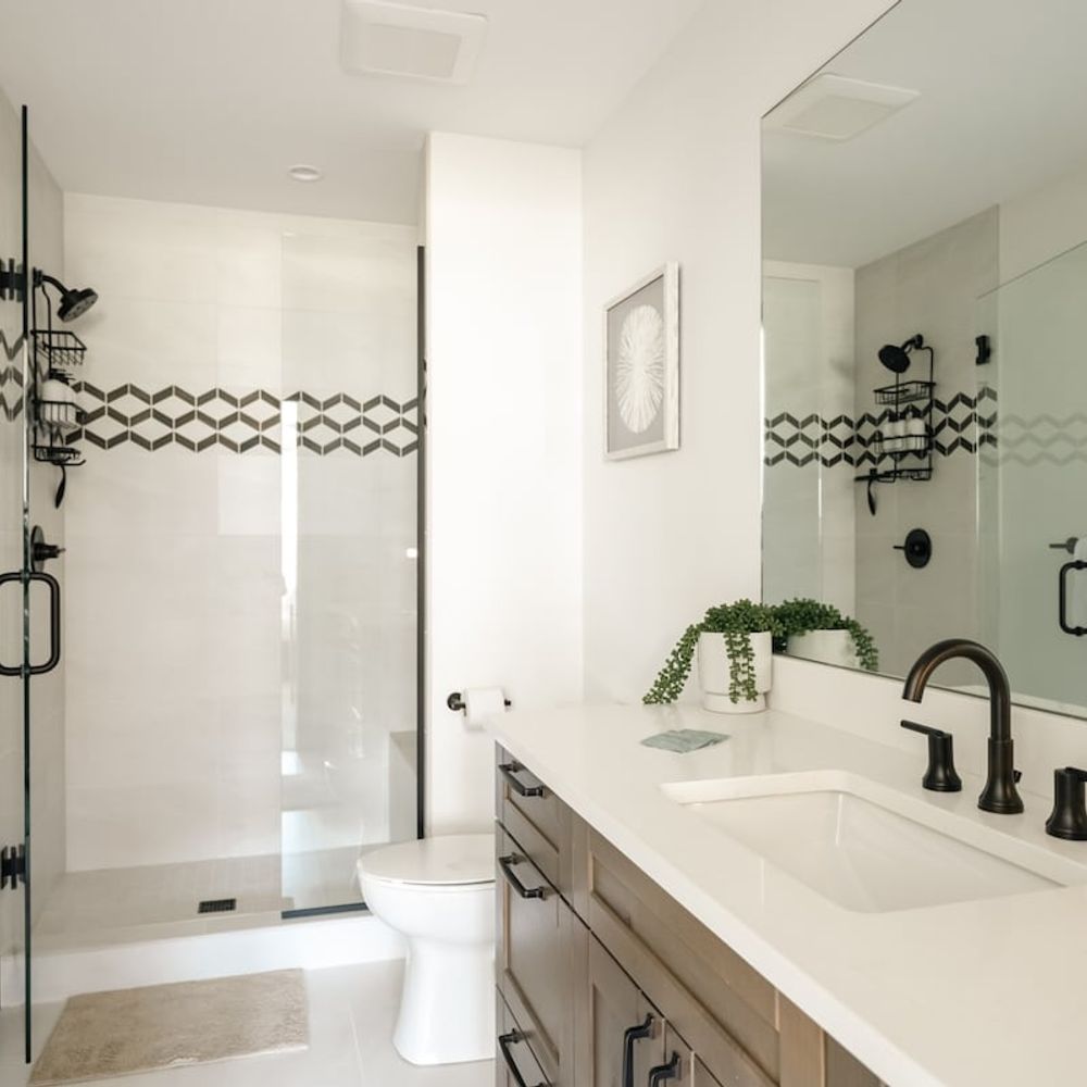 Ensuite primary bathroom with walk-in glass shower