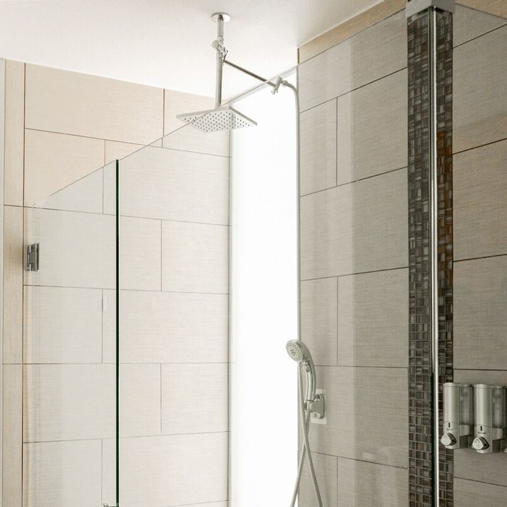 Indulge beneath a rain shower in the primary bathroom