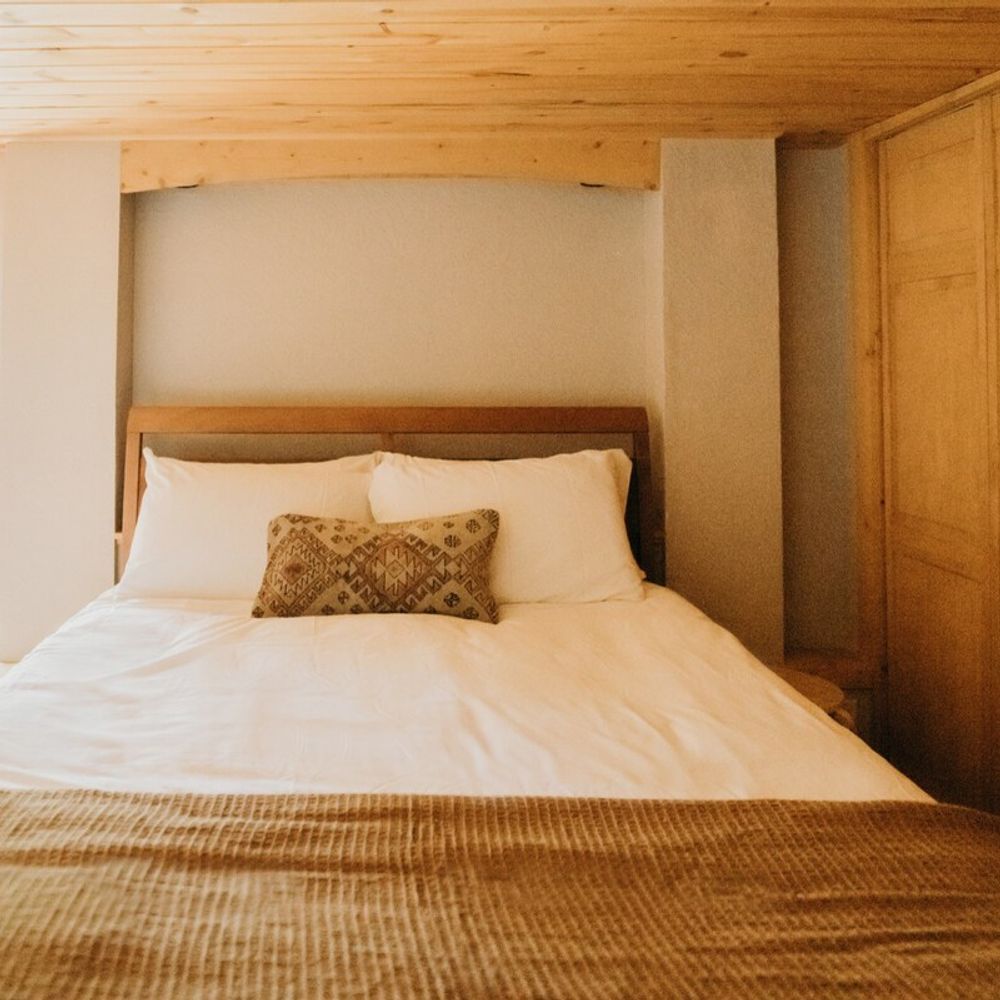 Basement bedroom features a queen sized bed