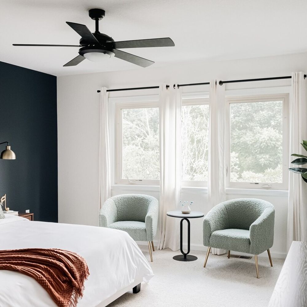 Primary king bedroom with chairs and table (now has an updated headboard)