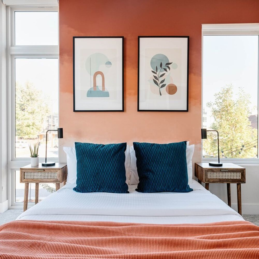 Bedroom 2 with queen bed and floor to ceiling windows