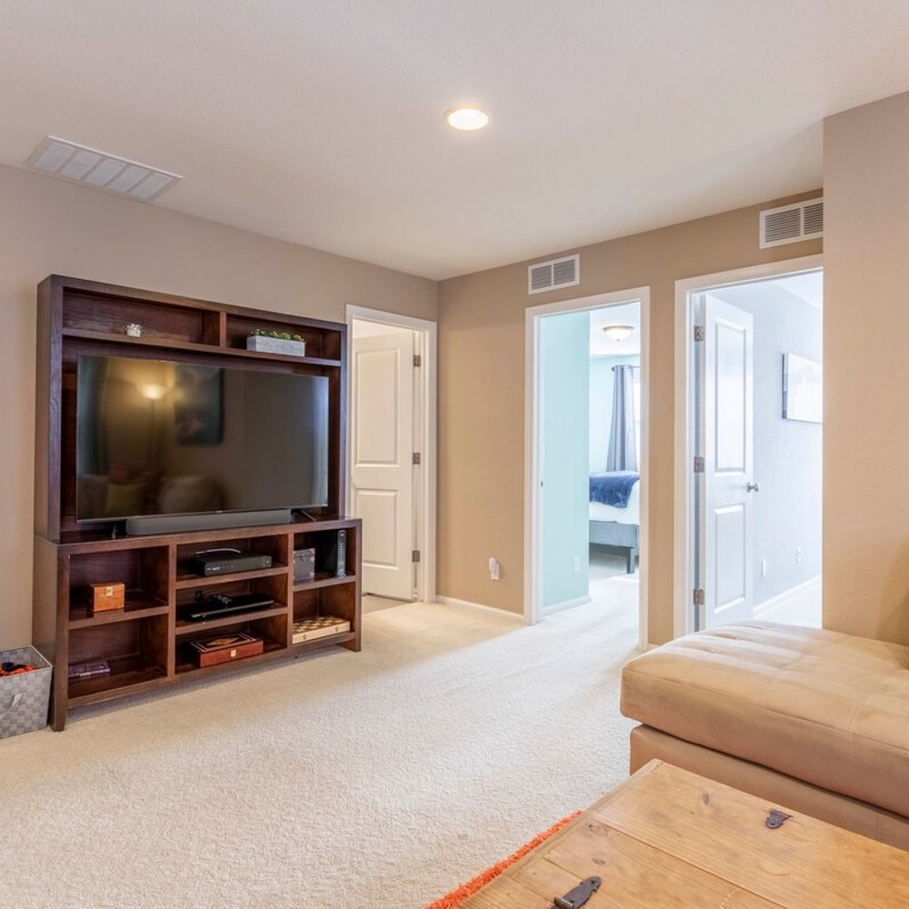Upstairs living area with TV