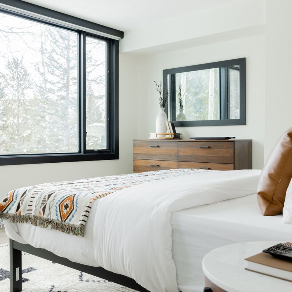 The bedroom has a king bed