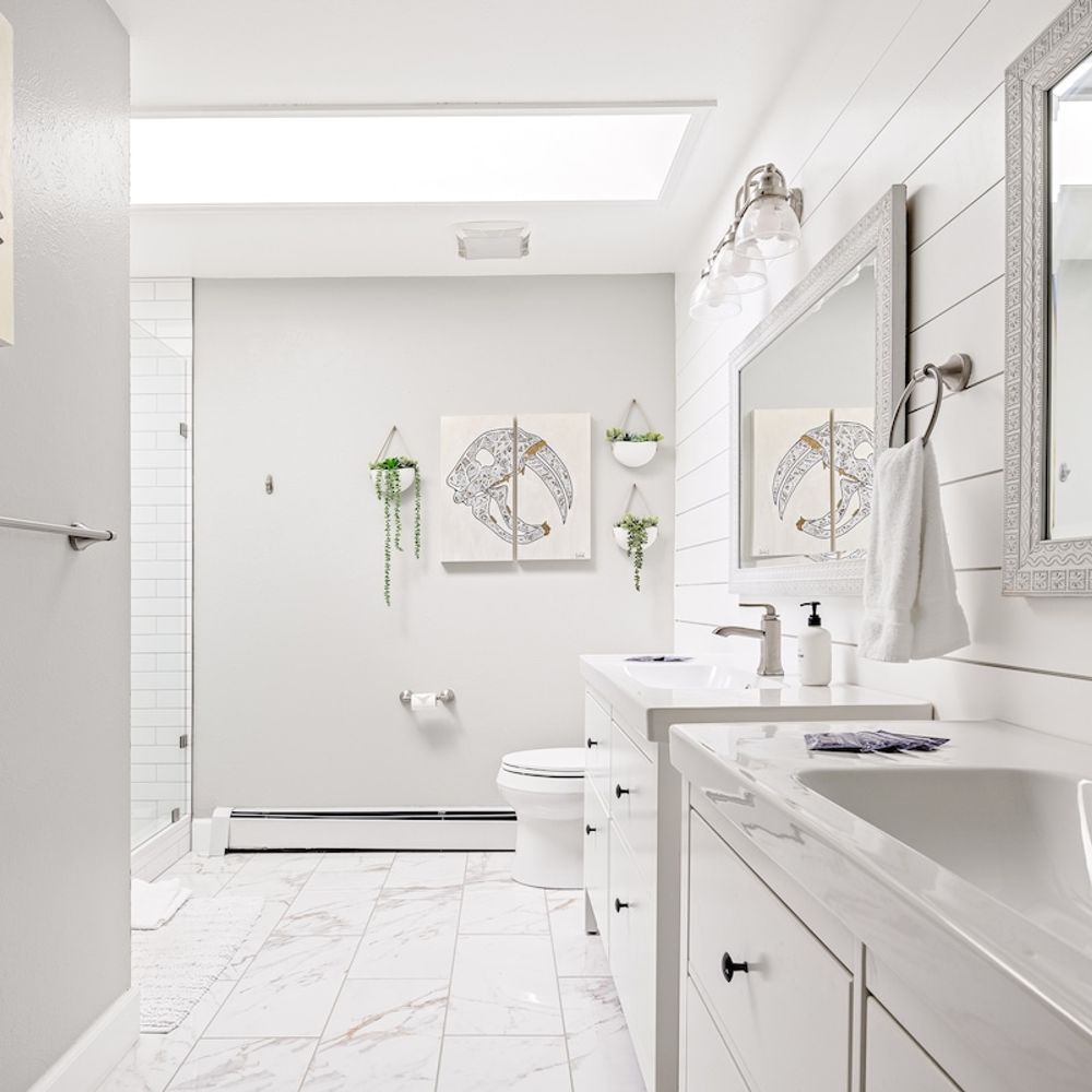 Large en suite bathroom with skylight