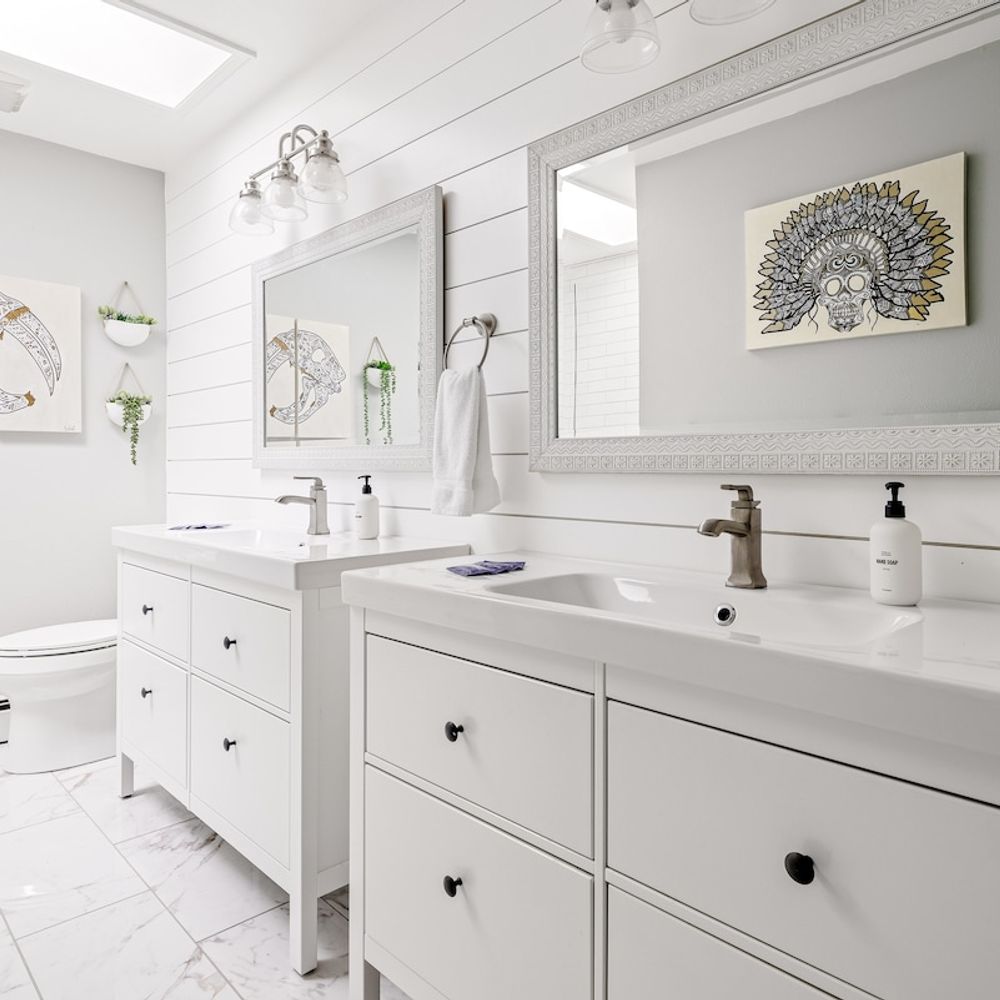 There are two vanities in the primary en suite bathroom