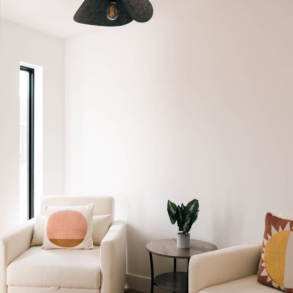 Entry room with two chairs that convert to twin beds