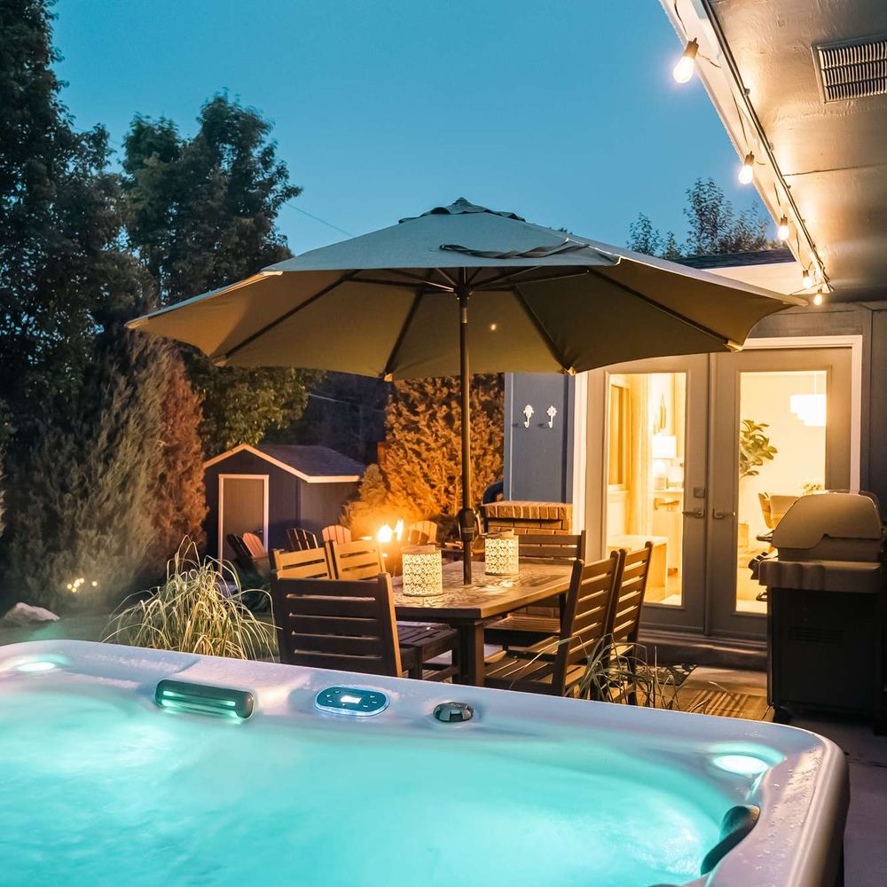 Hot tub, seating, and grill