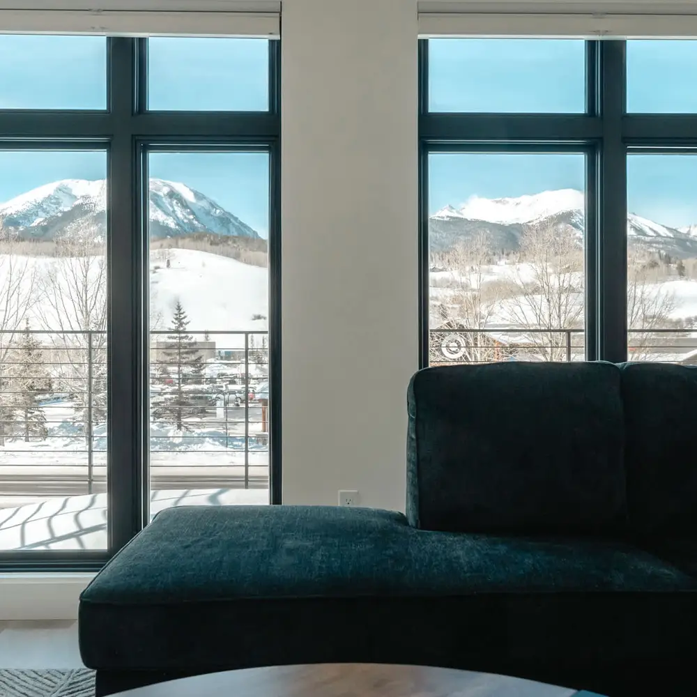 Main living area seating and balcony + Super Target across the highway