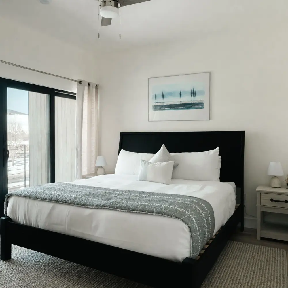Primary bedroom with king bed and private balcony