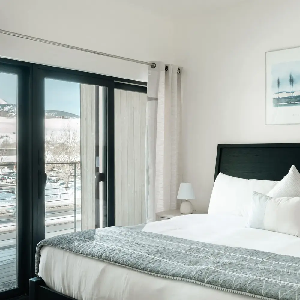 Primary bedroom with king bed and private balcony