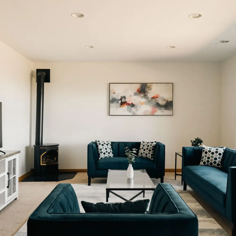 Lower-level living room with seating and a smart TV