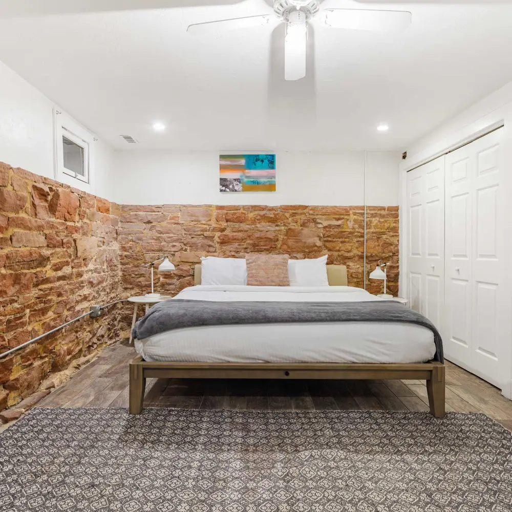 Bedroom 4 in basement with king bed