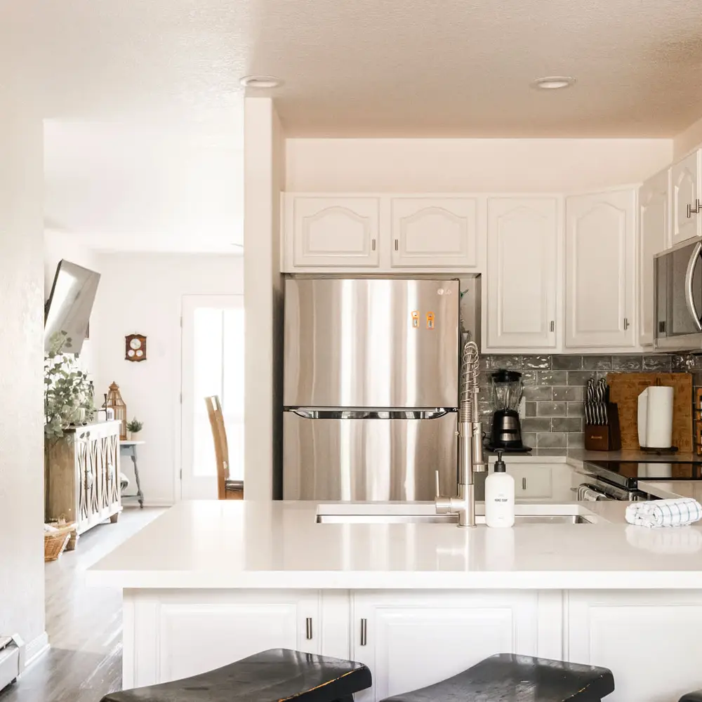Open kitchen with bar-style seating at the kitchen counter