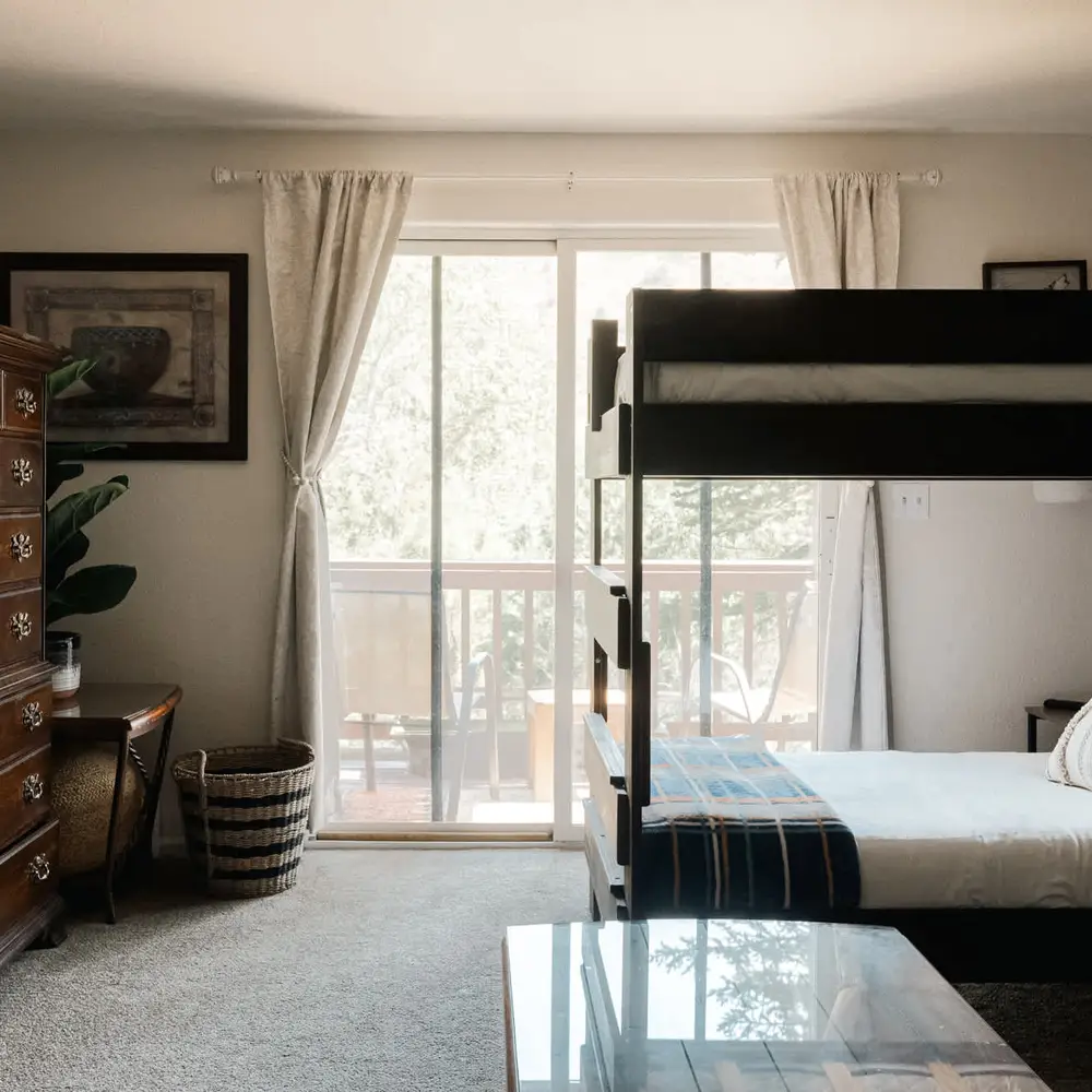 Bunk room with balcony exit