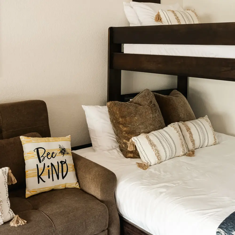 Queen-size sleeper sofa and twin over queen bunk in the bunk room