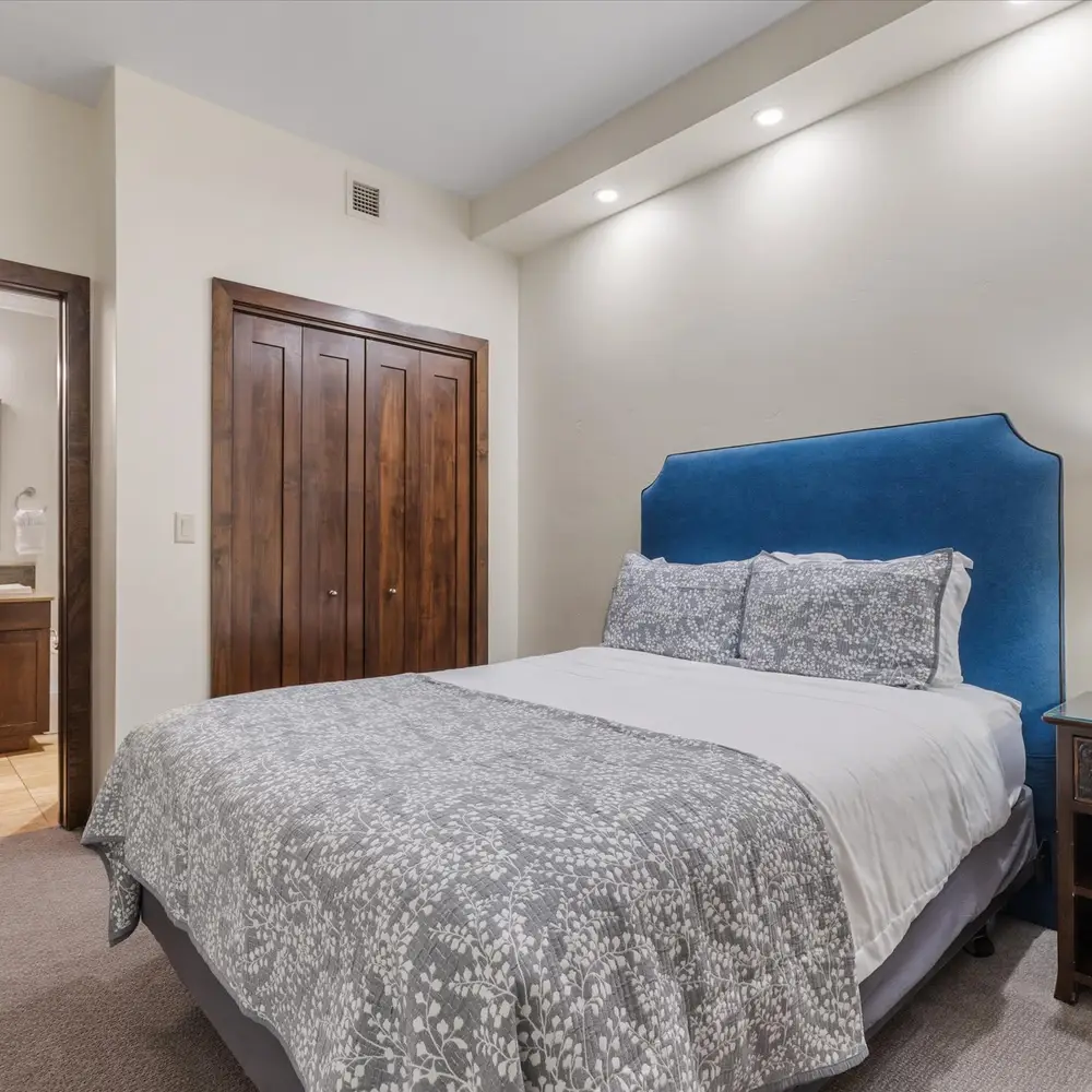 Bedroom 2 with queen bed and en suite bathroom