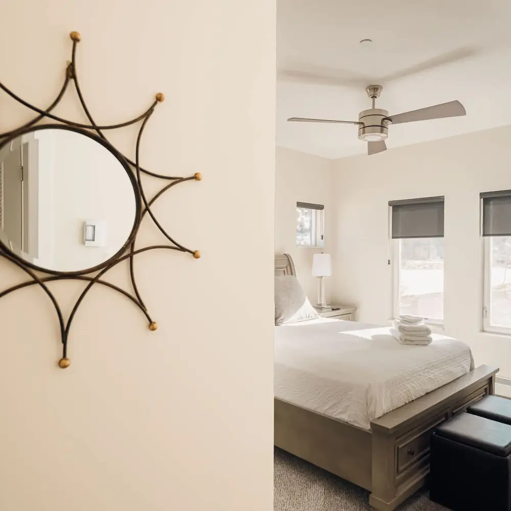 Primary bedroom with queen bed and flatscreen TV