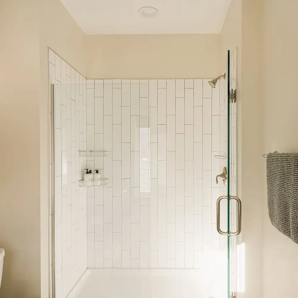 Primary ensuite bathroom with walk-in glass shower