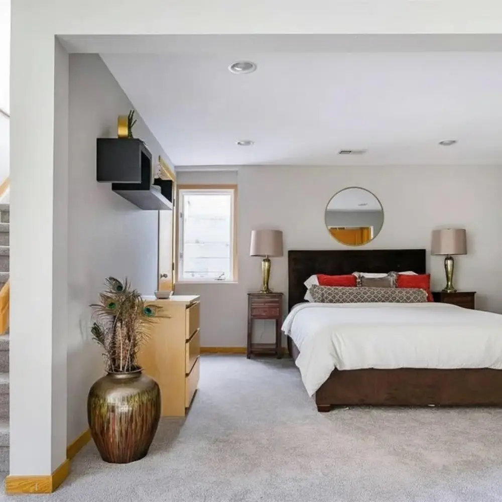 Large basement bedroom with queen bed