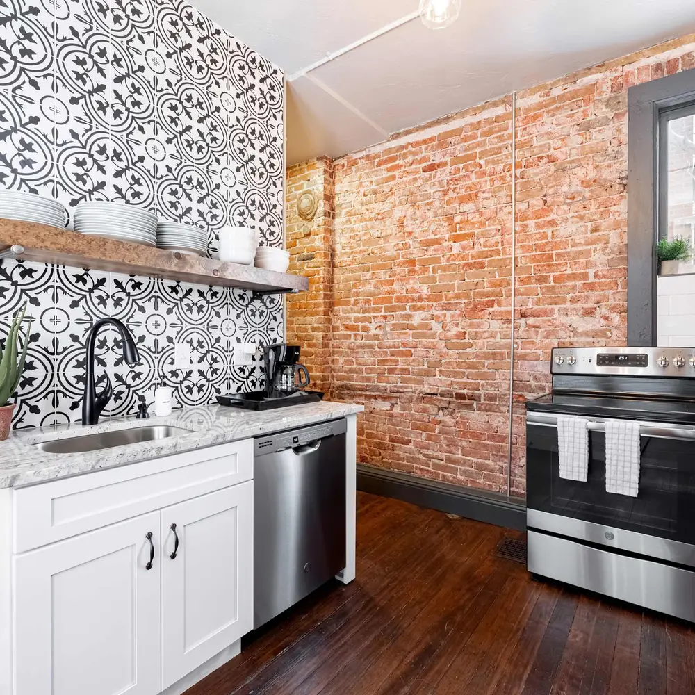 Kitchen with exposed brick on 1st floor