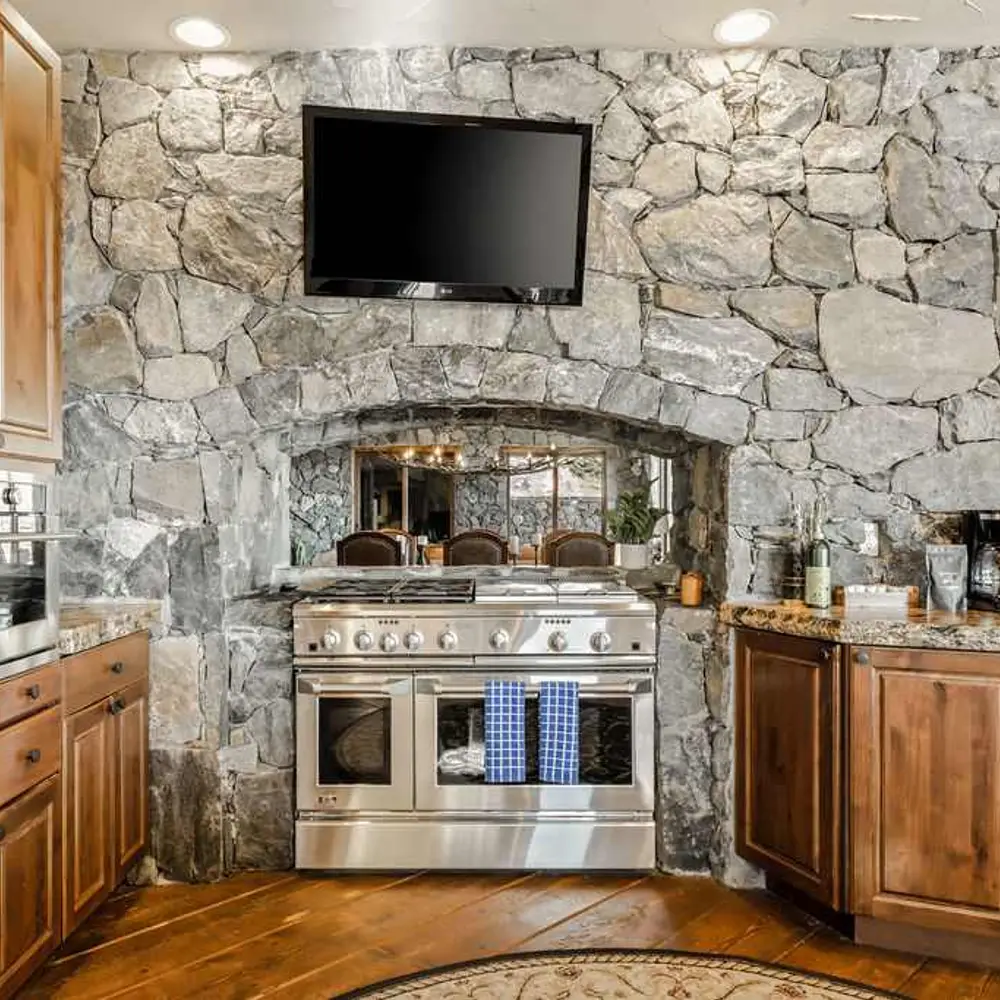 Luxe open kitchen with high-end stainless steel appliances