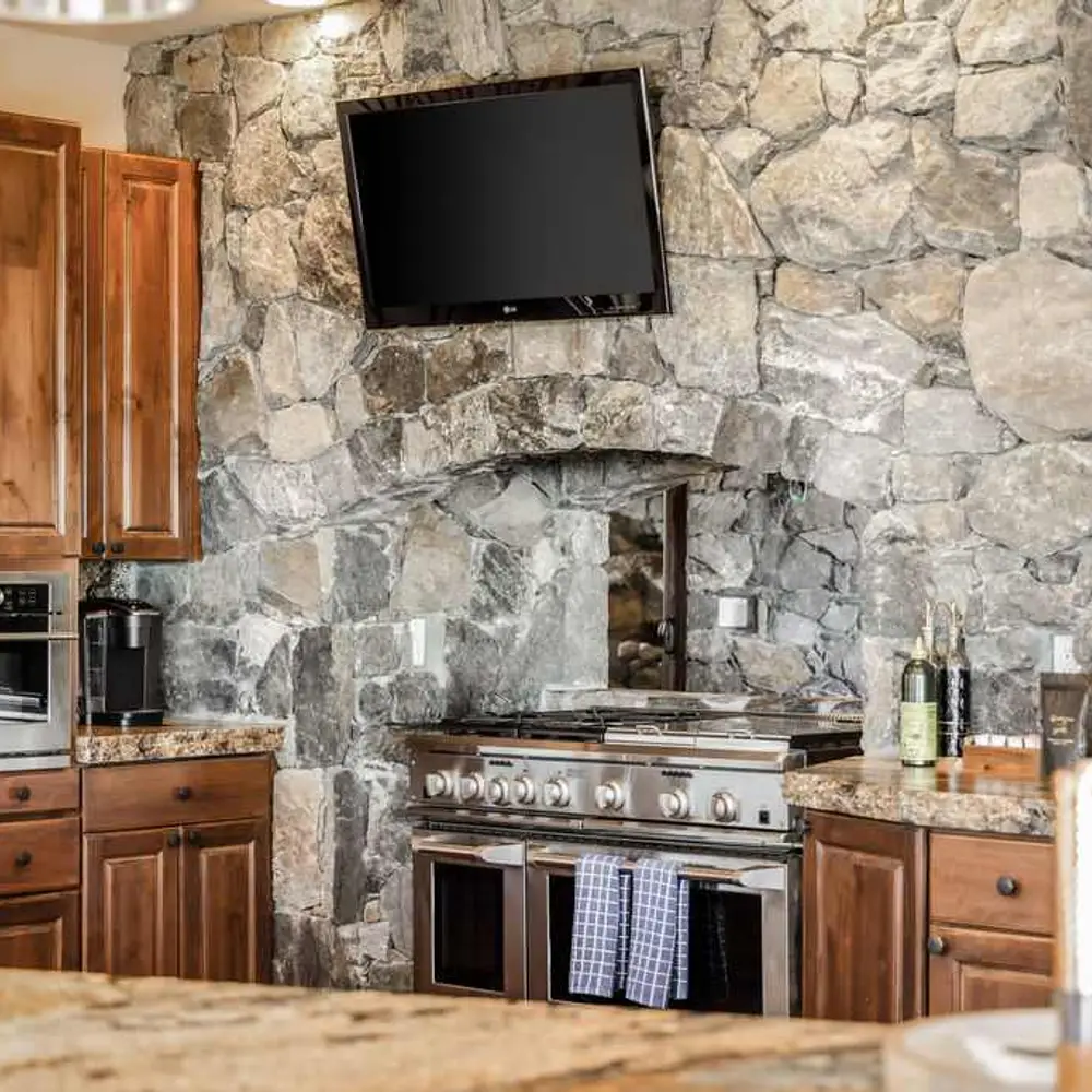 Luxe open kitchen with high-end stainless steel appliances