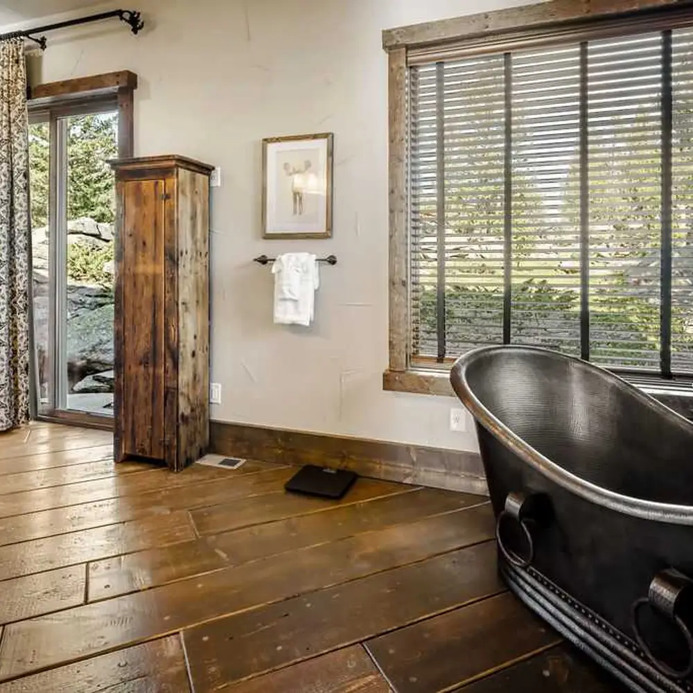 Primary full private ensuite bathroom with dual sinks, soaking tub, walk-in shower, and private patio exit