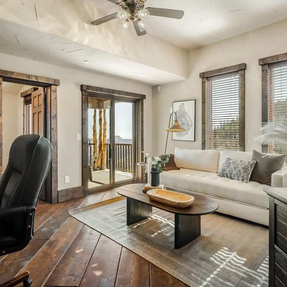 Office with workspace, queen-size sleeper sofa, private balcony, and private half bathroom
