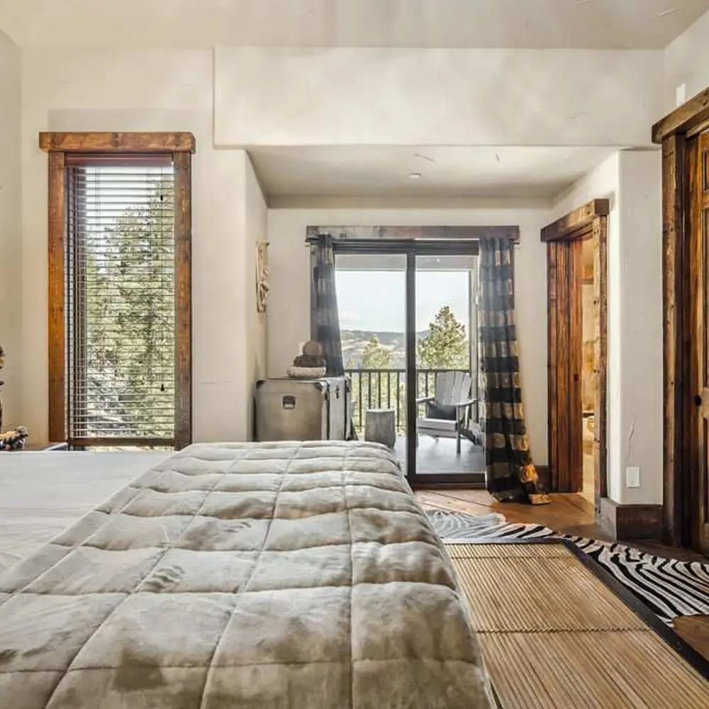 Bedroom 3 with a queen bed, private balcony, and a private full ensuite bathroom